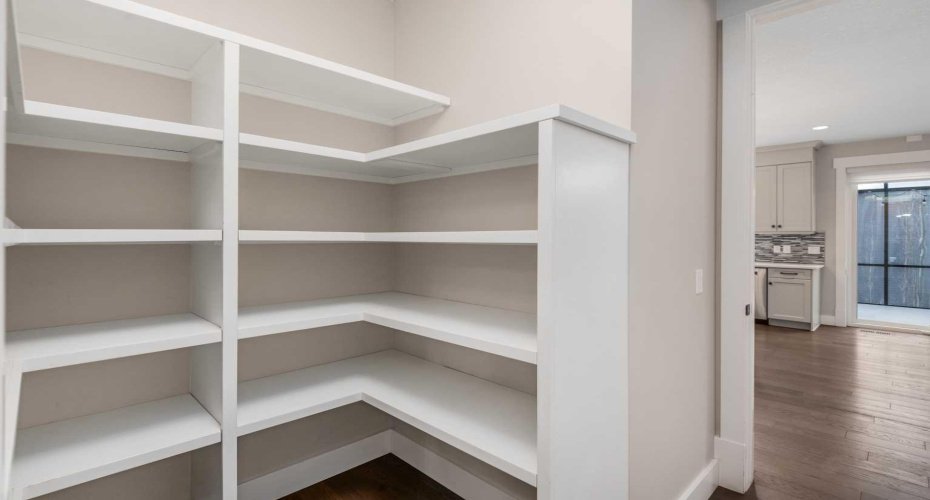 Large Walk Through Pantry with entry from the mudroom hallway