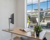 A bright and inspiring home office offers the perfect space to work remotely, study, or manage everyday life, with large windows filling the room with natural light throughout the day.