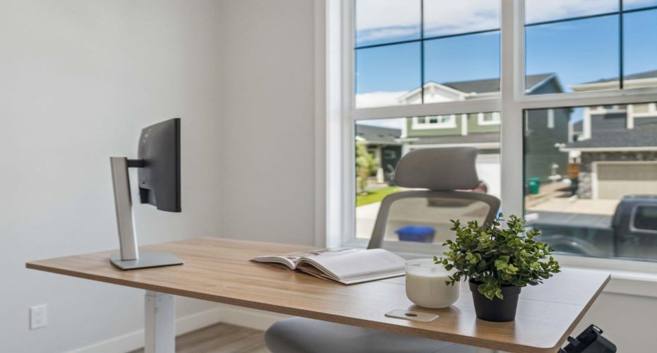 A bright and inspiring home office offers the perfect space to work remotely, study, or manage everyday life, with large windows filling the room with natural light throughout the day.