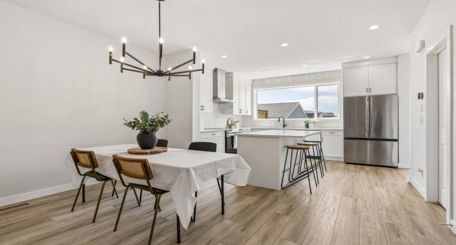 Whether you're hosting holiday dinners or enjoying casual weeknight meals, the spacious dining area flows effortlessly into the beautifully designed kitchen, making entertaining both easy and enjoyable.