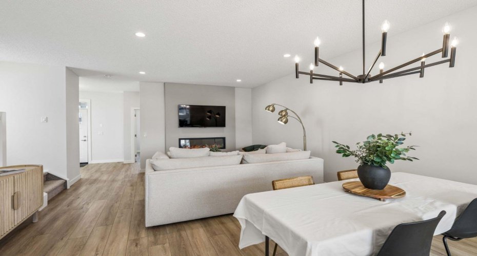 The heart of the home is thoughtfully designed for everyday living, offering an open-concept layout that brings together the kitchen, dining, and living spaces in one bright, connected environment perfect for entertaining and making memories.