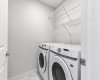 Conveniently located on the upper level, the dedicated laundry room keeps daily routines simple with side-by-side appliances, built-in shelving, and plenty of storage space.
