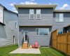 Designed for easy outdoor living, the backyard combines a spacious concrete patio with a low-maintenance yard, creating the perfect backdrop for relaxing or entertaining all summer long.