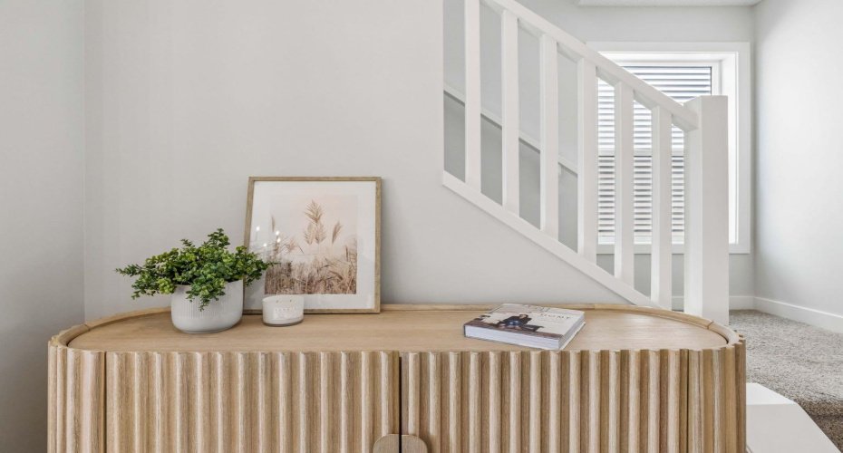 A thoughtfully designed entry welcomes you with modern finishes and timeless style. The open staircase, natural light, and elegant details create a warm, welcoming atmosphere from the moment you arrive.