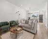 Designed for both relaxing evenings and entertaining, the inviting living room features an open-concept layout that seamlessly connects to the kitchen and dining area, creating the perfect space to gather with family and friends.