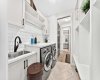 Well-Appointed Laundry & Mudroom complete with a sink and plenty of storage!