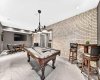 Brick-Lined Games Room With Bar Seating