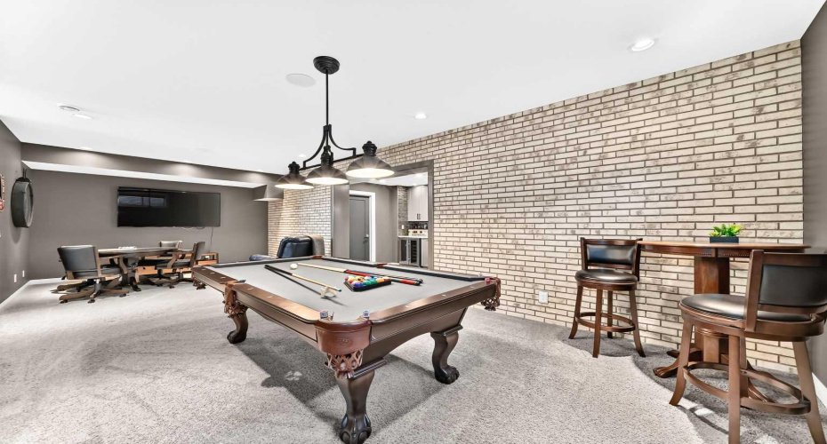 Brick-Lined Games Room With Bar Seating