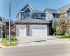 Stone-Accented Exterior With Triple Garage