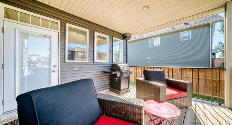 Covered Deck Overlooking The Backyard