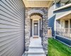 Covered Front Entry With Stone Archway