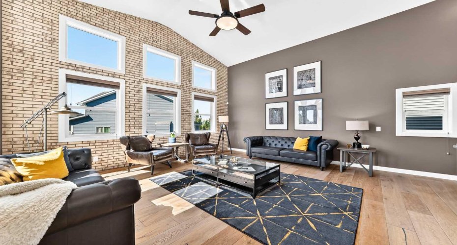 Vaulted Living Room With Brick Feature Wall