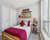 Guest bedroom has double closets.