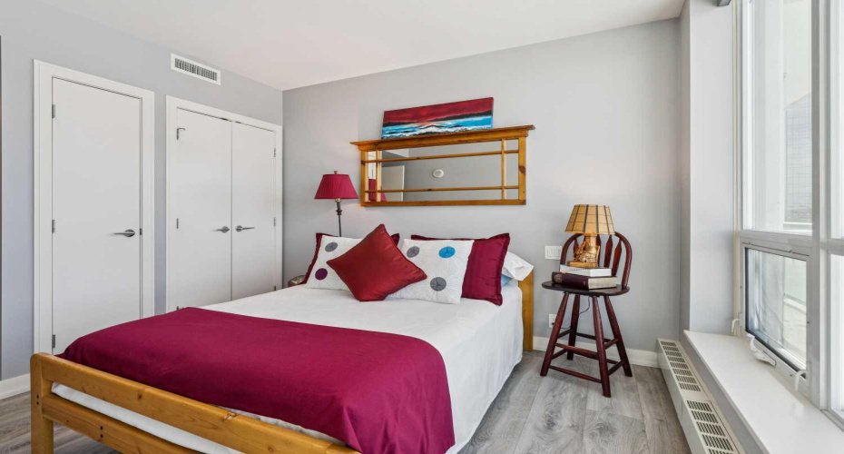 Guest bedroom has double closets.
