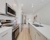 Modern kitchen with quartz counters and stainless steel appliances