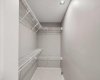 Lower walk in closet virtually decluttered