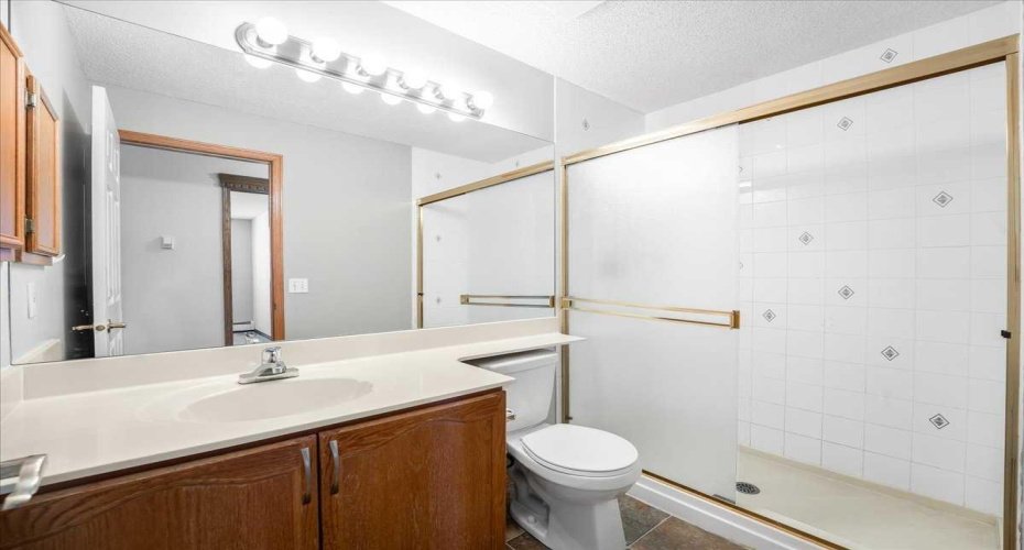 Main Bathroom features a large tiled shower.
