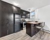 Kitchen is fully equipped with a fridge, stove, dishwasher, and microwave, plus pantry-style cabinets