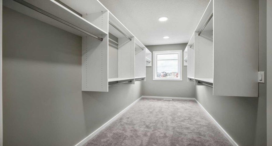 The huge walk-in closet in the primary bedroom - the home is under construction, so images are of a similar build for illustration purposes.