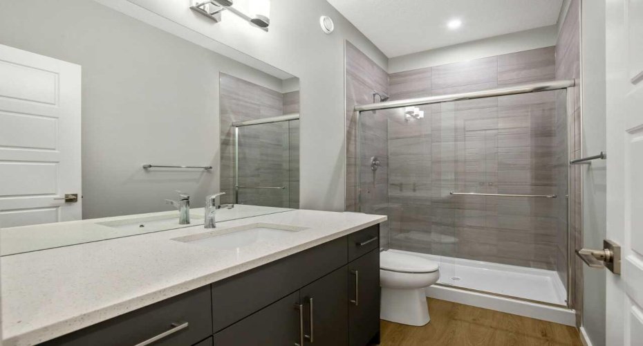 Main floor full bathroom with shower - the home is under construction, so images are of a similar build for illustration purposes.