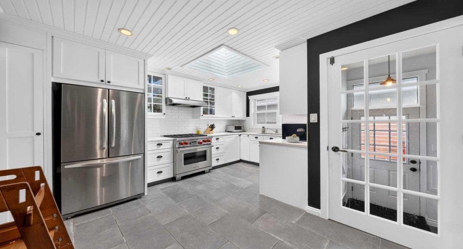 the stunning eat-in kitchen, complete with premium stainless steel appliances