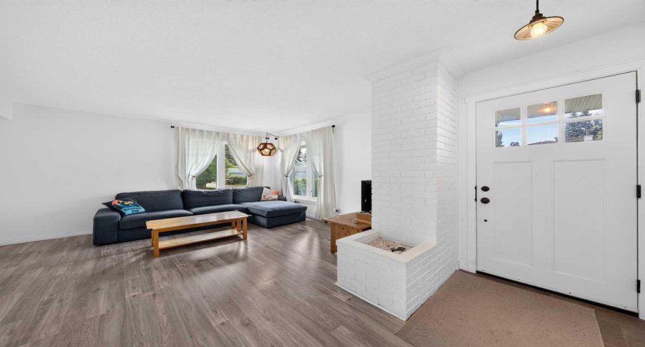 living room filled with natural light from expansive windows