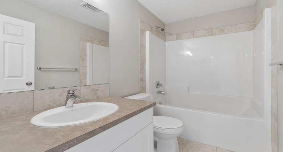 Fresh, bright, and thoughtfully designed, the full bathroom offers a functional layout with timeless finishes, making busy mornings and evening routines feel effortless.