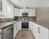 Clean, modern finishes and an abundance of workspace make this kitchen equally suited for hosting friends, preparing holiday meals, or simply enjoying the rhythm of everyday life.