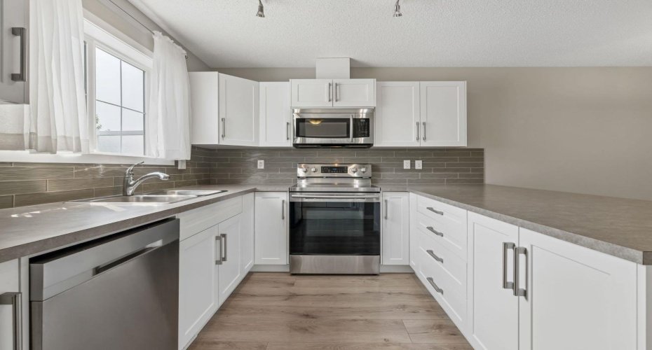 Clean, modern finishes and an abundance of workspace make this kitchen equally suited for hosting friends, preparing holiday meals, or simply enjoying the rhythm of everyday life.