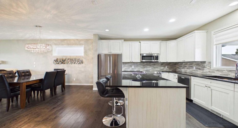This gorgeous kitchen showcases ample storage space, offering abundant cabinetry to keep everything organized while combining style with everyday functionality.