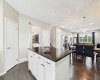 Beautiful granite countertops take center stage in this gorgeous kitchen, complemented by abundant cabinetry and ample storage space for exceptional style and everyday functionality.