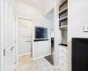 The spacious mudroom features a well-designed built-in, providing the perfect place to neatly tuck away coats, shoes, backpacks, and everyday essentials.
