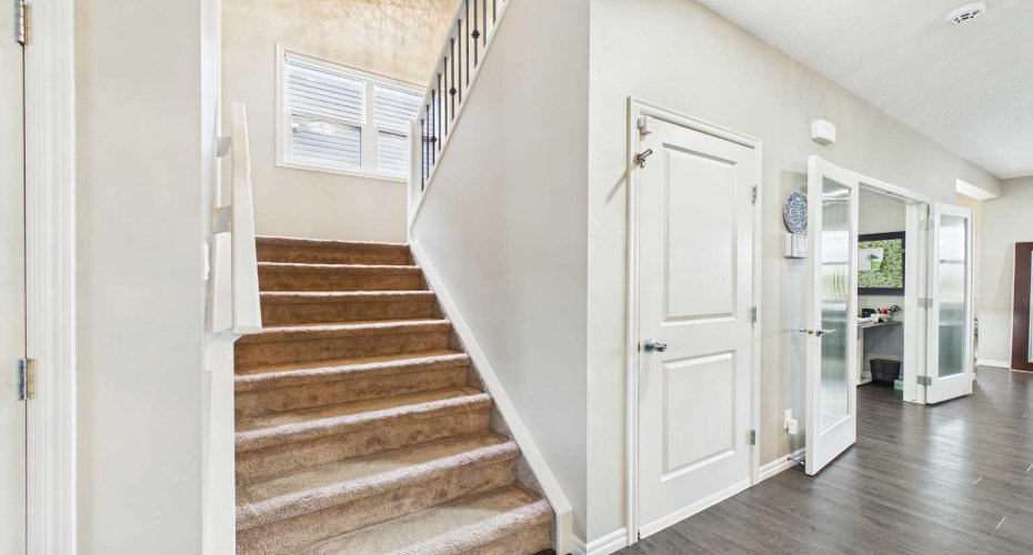 Carpeted stairwell leading up to the second floor.