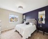 The spacious primary bedroom serves as a peaceful retreat, offering generous proportions and everything you need for restful nights and relaxing mornings.