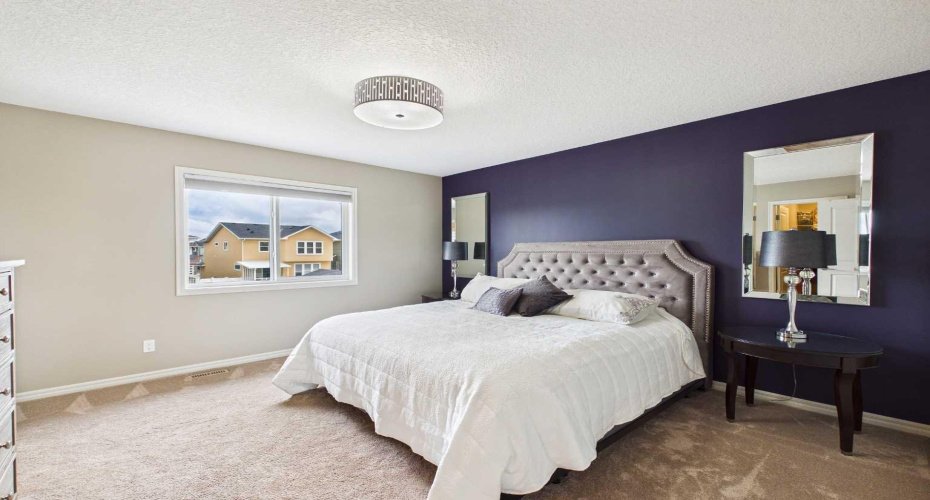 The spacious primary bedroom serves as a peaceful retreat, offering generous proportions and everything you need for restful nights and relaxing mornings.
