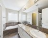 Unwind in the spa-inspired 5-piece primary ensuite, complete with double vanities, a deep soaker tub, and plenty of space to start and end your day in comfort.
