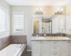 Unwind in the spa-inspired 5-piece primary ensuite, featuring double vanities, a deep soaker tub, a separate walk-in shower, and a private water closet (toilet room). Thoughtfully designed with generous space and elegant finishes, it's the perfect retreat to start and end your day in comfort.