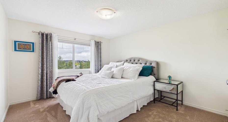 Spacious upstairs Bedroom 2 featuring a large closet and plenty of storage.