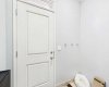 Separate side entrance leading directly to an unpermitted two-bedroom secondary suite.