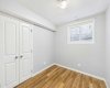 Illegal Basement Suite: Bedroom 1 is spacious and features a good-sized closet and a large egress window that provides ample natural light and an emergency exit for safety. This bedroom is part of an illegal (non-conforming) basement suite that has not been approved as a legal secondary suite.