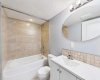 4-Piece Bathroom (Illegal Basement Suite): Well-maintained 4-piece bathroom serving the illegal (non-conforming) basement suite, complete with a bathtub/shower, toilet, and vanity, offering convenience and functionality for occupants.