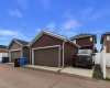Rear Parking: Paved back alley with an additional parking stall adjacent to the garage, providing extra off-street parking and added convenience for multiple vehicles.
