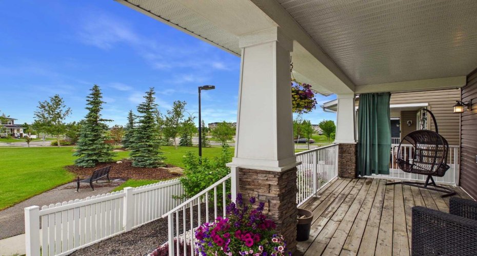 Relax on the Front Porch and Enjoy Unobstructed Greenspace Views.