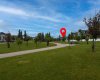 Front Greenspace View: Views of the attractive greenspace located directly in front of this beautifully crafted Trico-built home. The dot indicates the location of the subject property, highlighting its desirable position and proximity to the open green space.