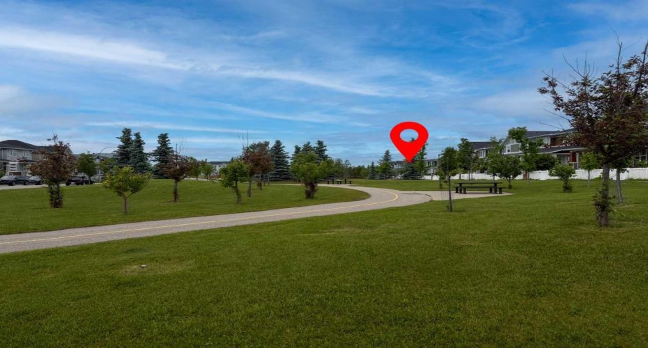 Front Greenspace View: Views of the attractive greenspace located directly in front of this beautifully crafted Trico-built home. The dot indicates the location of the subject property, highlighting its desirable position and proximity to the open green space.