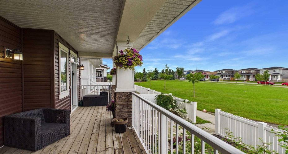 Unwind on the front porch while taking in peaceful, open greenspace views