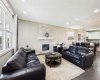 The inviting main floor living area features a cozy fireplace and is seamlessly integrated into a thoughtfully designed open-concept floor plan, creating the perfect space for everyday living and effortless entertaining.