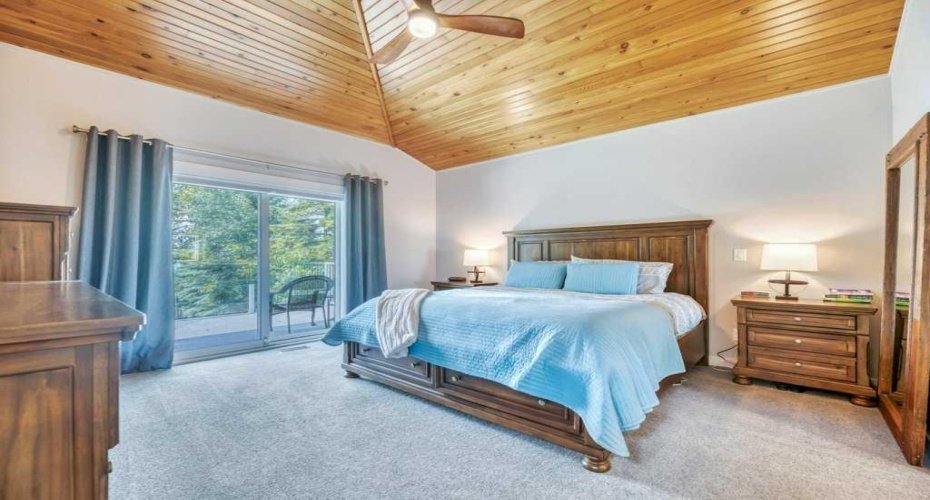 Primary Bedroom with Lake Views & Private Deck Access