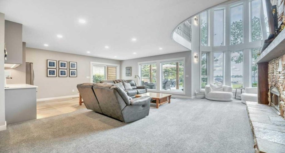 Walk-Out Basement with a Wall of Windows Open to Above