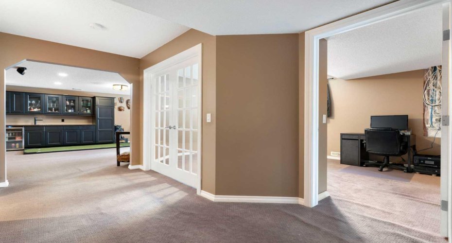 French Doors & Regular Door Entry to Basement Bedroom